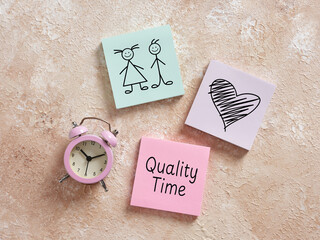 Quality time together: alarm clock, couple and heart representing spending time with loved ones