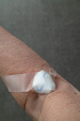 Arm with bandage after blood draw