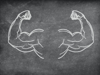 Strong arms flexing biceps on blackboard showing strength and power