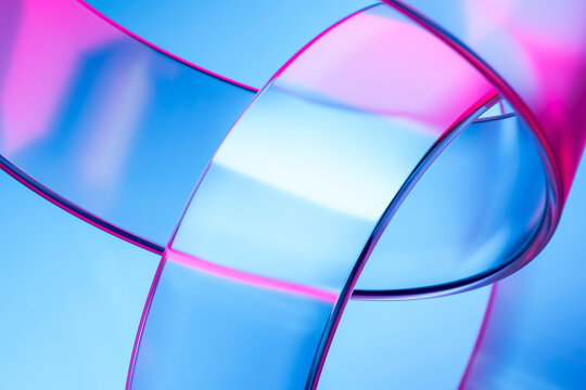 Abstract 3D glass rings with neon reflections in blue and pink colors