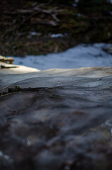 The waterfall is frozen, covered with ice in winter.