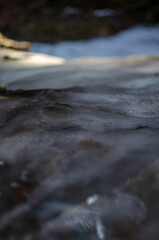 The waterfall is frozen, covered with ice in winter.