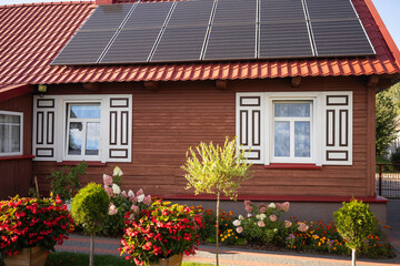 A house with a red roof and white trim
