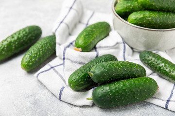 Cucumber on wooden background. Slice of cucumber on background. Fresh organic green cucumbers gherkin. Vegan. Salad ingredient. Farm vegetables. Cut vegetables with knife. Space for text. Copy space