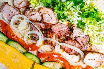 Delicious grilled chicken wrap with fresh vegetables and cheese