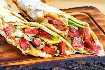 Delicious wrap filled with fresh ingredients and savory meats