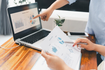 Financial business team in office, financial expert analyze business report graph and finance chart at corporate office. Concept of finance economy, banking business and stock market research.