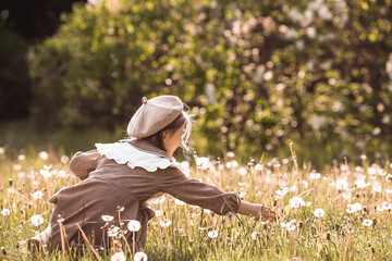 Vintage women's accessories and retro-style clothing. A small, beautiful girl with bows in her...