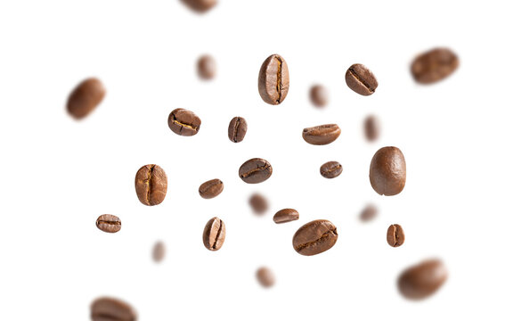 Coffee beans levitate. Roasted coffee beans flying on white background with clipping path. Close up image.