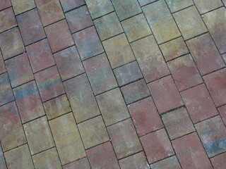 Rectangular paving stones with autumn tones on new harbor promenade. Space for texts and designs.