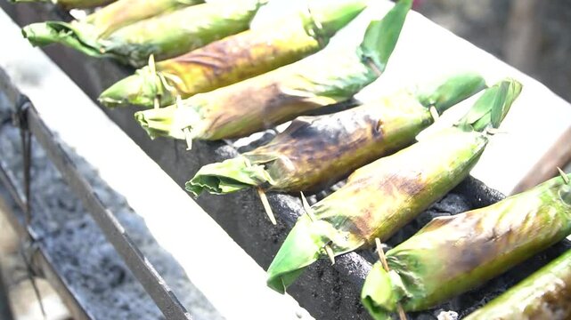 Acehnese specialty food, sticky rice wrapped in banana leaves and grilled