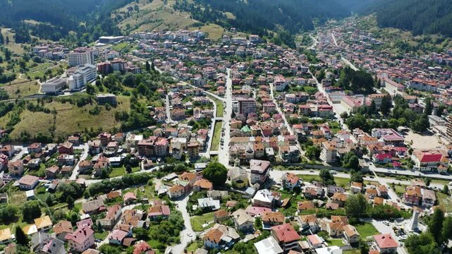 Establishing aerial shot of a church in a small town
