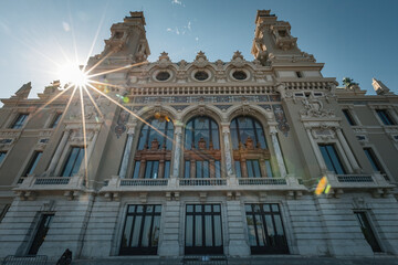 Detailed front facade of the Salle Garnier, the historic opera house inside the Monte Carlo Casino in Monaco, showcasing Belle Époque architecture with intricate carvings, arched windows