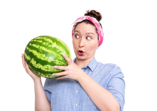Surprised young woman holding a big watermelon, looking amazed. Studio portrait, humorous expression, isolated on transparent background PNG.