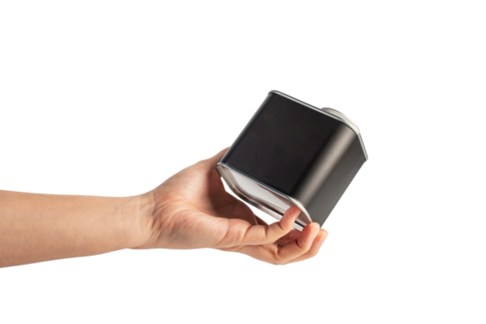 Black can for packaging in hand on transparent background.