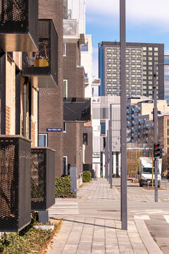 Sidewalk in &Oslash;restad, Copenhagen with modern residential buildings, trees, and clean urban lines, perfect for architecture, real estate, and contemporary urban stock.