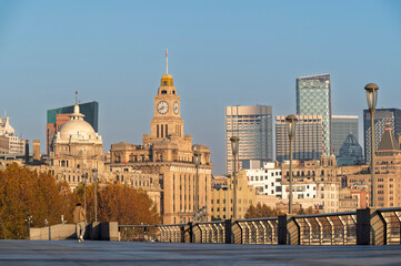 Morning sunrise of Historical architecture on the bund of Shanghai with reflection of buildings in...