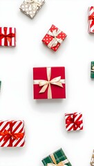 Colorful gift boxes with ribbons isolated on white background, top view