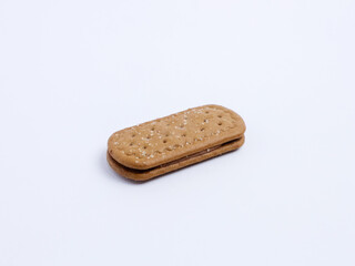 Single chocolate cream sandwich biscuit isolated on white background