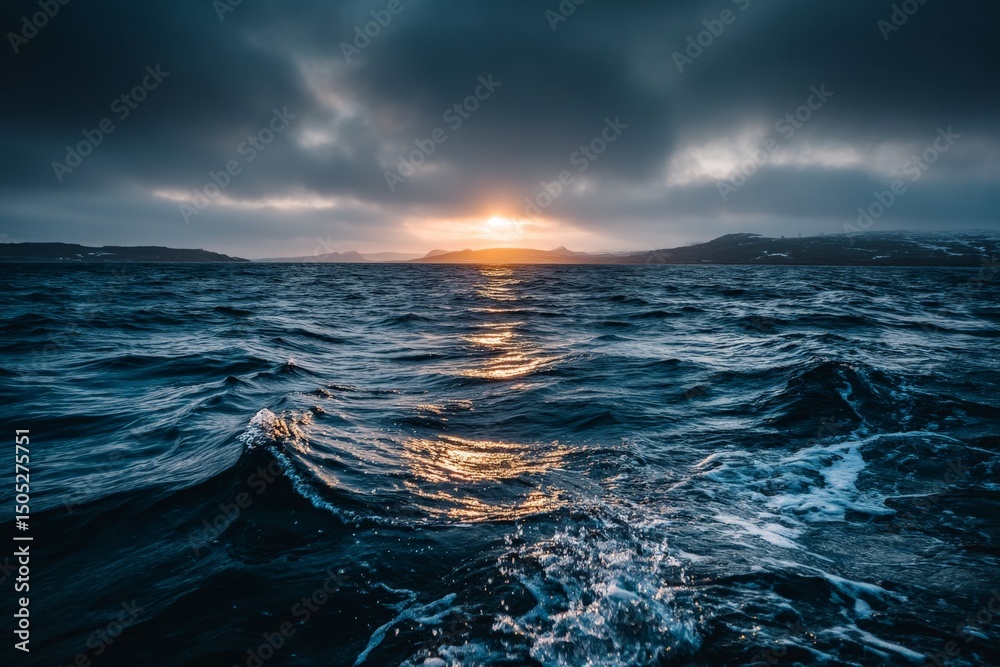 Poster sunset over the ocean with dark clouds gathering on the horizon, creating a dramatic seascape in the