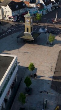 Portrait Drone Pass Over Hoddesdon town center, Clock Tower, War Memorial, and Traffic
