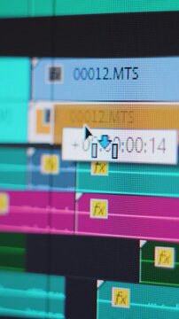 Video editing. Moving and trimming a video clip on a complex timeline. Screen close up