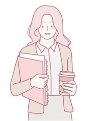 A confident woman holds important files and a steaming cup of coffee, ready for a productive workday