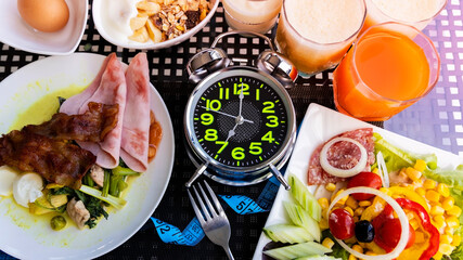 Alarm clock with IF (Intermittent Fasting) 16 and 8 diet rule and weight loss concept.-Diet plan concept