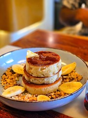 Traditional stack of fluffy American pancakes, often served at breakfast.