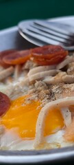 pan-fried egg with pork and toppings. Breakfast food in Thai style