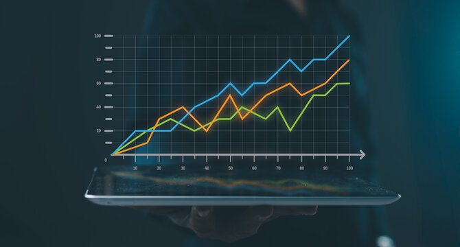 A digital tablet displays a glowing, upward-trending line graph, symbolizing data growth, analysis, and business progress.
