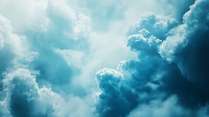 A soft ethereal blue cloud with dynamic swirling patterns creating a peaceful sky scene
