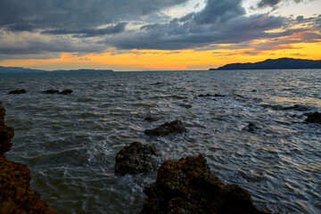 Fototapeta premium Silhouette of sunset and dramatic sky over the sea at southern Thailand