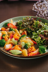Salad with dressing and fresh vegetables