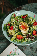 Salad with dressing and fresh vegetables