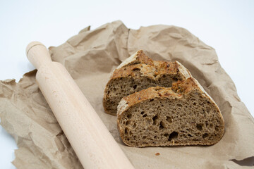 sliced ​​black bread. rolling pin for dough