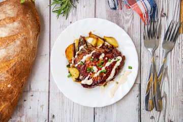 Grilled bone in pork chops with potato,