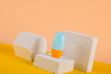 Cosmetic product in tube, bottle, lotion or serum with stylish props on cream background. 