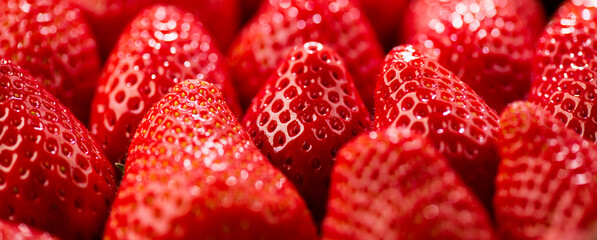 Strawberry, fresh ripe strawberries background close-up. Organic Vegetarian healthy food backdrop, macro shot 