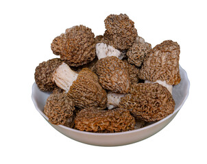 Fresh morel mushrooms in a bowl isolated on transparent background, These gourmet wild mushrooms are prized for their rich flavor and unique honeycomb appearance.