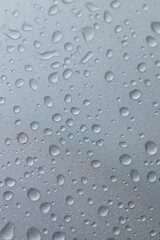 water drops on the silver metal surface, abstract background, macro drops after the rain, grey car after carwash