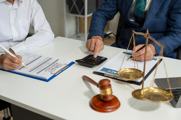 Teamwork of business lawyer meeting working hard about legal legislation in courtroom to help their...
