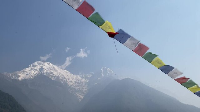 Chhomrong Gumba Stupa decorated with colorful prayer flags in Annapurna Base Camp trek, Nepal.	