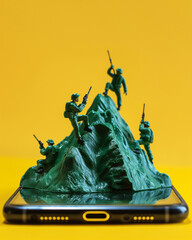 Plastic Toy Soldiers Climbing a Mountain on Smartphone, Yellow Background Representing Digital Warfare and Modern Conflict. Generative AI