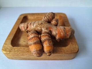 Turmeric rhizome. It's a traditional herbal plant in Indonesia that has many health benefits. Turmeric is often used in traditional medicine and also in cooking as a flavoring and natural coloring