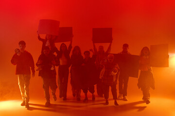 March of demonstrators, people diverse nationality and ages, in red neon light with posters and megaphones, walking expressing anger and disagreement. Human rights, hope, unity, social issues concept