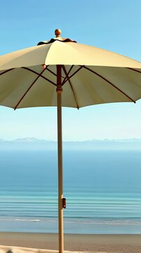 Beach umbrella standing against the clear ocean view on sunny day  