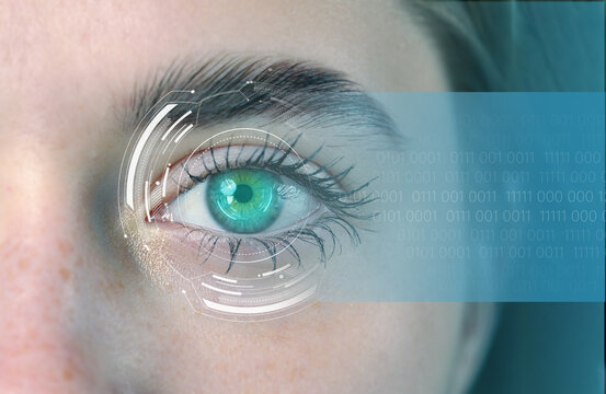 Close-up of a human eye with digital overlays showing biometric data and futuristic elements in a technology setting