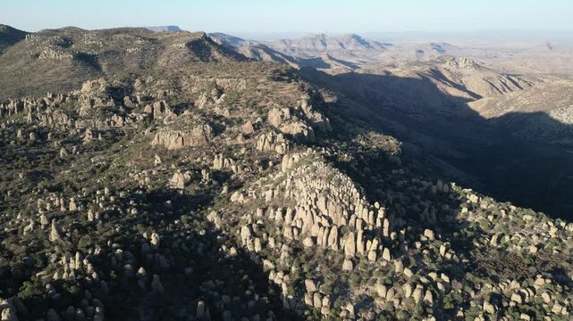 Rocky stone spires in Valle de los Monjes, Creel, surrounded by rugged mountains