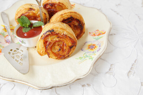 mini pizza rolls on vintage serving plate